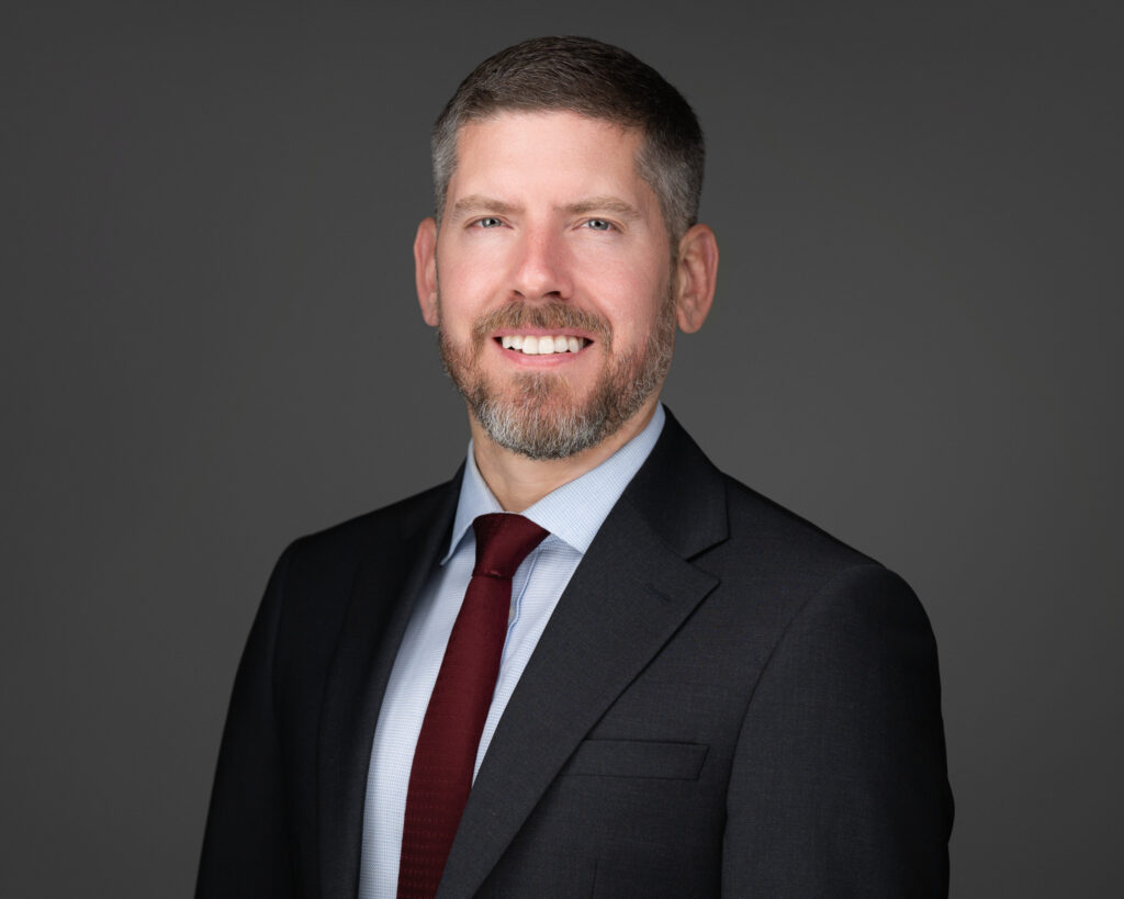 Professional headshot of a man in a suit and tie photographed in McLean VA